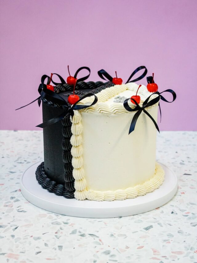 Half & HalfHow crazy is this "half and half" all-vegan celebration cake? The black "Rip 20's" side features our rich vegan chocolate cake layered with Belgian chocolate frosting, while the white "Hello 30's" side boasts our vegan red velvet cake layered with vegan cream cheese frosting - finished with cute black bows and maraschino cherries. Divine!...#crumb #crumbcakes #crumbcakessa #vegan #veganbycrumb #celebrationcake #celebrationcakes