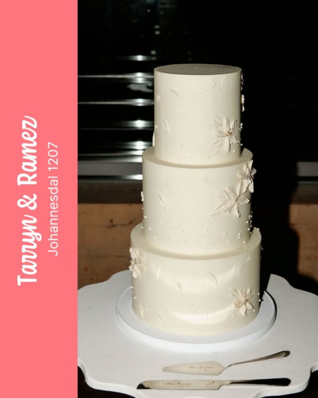 TARRYN & RAMEZ 
...
Our "it girl" Lita looking super striking at Tarryn & Ramez's wedding reception at @johannesdal.1207 🫶
...
This version of our Lita cake had super smooth sides and sharp edges, with subtle buttercream flowers details. 
Thank you for making us a part of your big day T & R 🩷
...
Expertly coordinated by @nu__experiences
An exceptional photo (as always)  by @aglowceleste