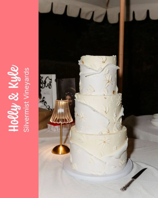 HOLLY & KYLE
...
Holly & Kyle celebrated their big day with our incredible 3 tier cake design, Lita. This version of our ever popular Lita was covered in vanilla bean buttercream with smooth sides and sharp edges. We decorated the cake with sheets of textured & torn fondant, buttercream petals and a touch of gold sprinkles. A huge shout out to the team at @nu__experiences for always trusting us to interpret your beautiful briefs - we love working with you! 🫶
... 
Coordinated by @nu__experiences 
Photography by @chrisandsun
Venue @silvermistvineyards