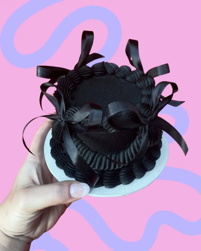 Baby Bow Peep - but make it black! 🖤🖤🖤Our Baby Bow Peep mini cake, covered in black buttercream, and paired with black bows. Badass, and available to order from our online store.🖤🖤🖤Our mini cakes measure 10cm x 2 layers tall, perfect for sharing, or eating it all by yourself. We don't judge 😘