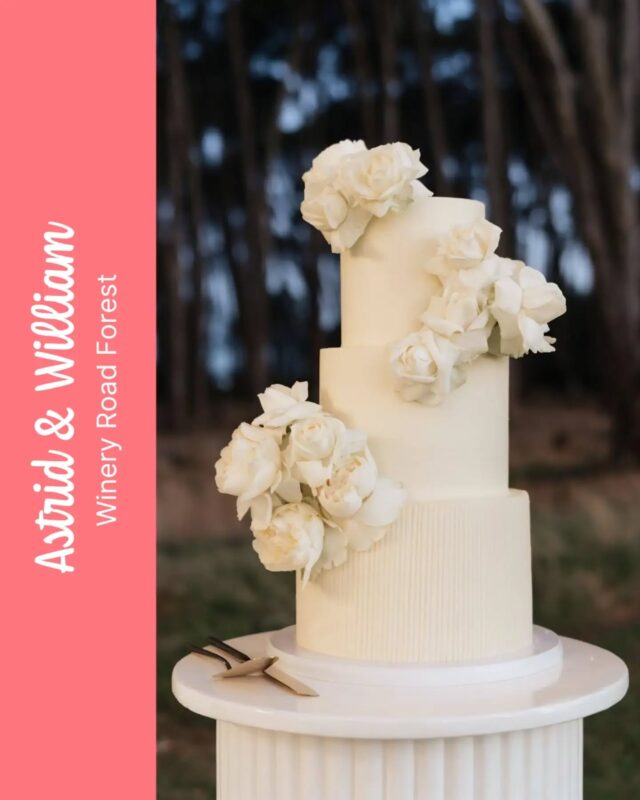 ASTRID & WILLIAM🤍🤍🤍There's something super striking about this cake against the moody evening forest backdrop at @wineryroadforests ...The fine vertical lines on the bottom tier of this cake were created by using a hot metal scraper and individually creating each line one by one by pressing the scraper into the buttercream... Then rinse the scraper, wipe it, heat it again, then repeat the process again and again .... A true labour of love ...This beautiful version of our Lita cake size consisted of Red Velvet, Rich Chocolate & Very Vanilla...#weddingcake #weddingcakes@deleeuw.photo @wineryroadforests